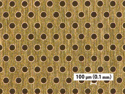 金・チタン箔とポリイミドフィルムにメカニカルな方法で微細孔 （直径100 μm）を施した試作品を公開
